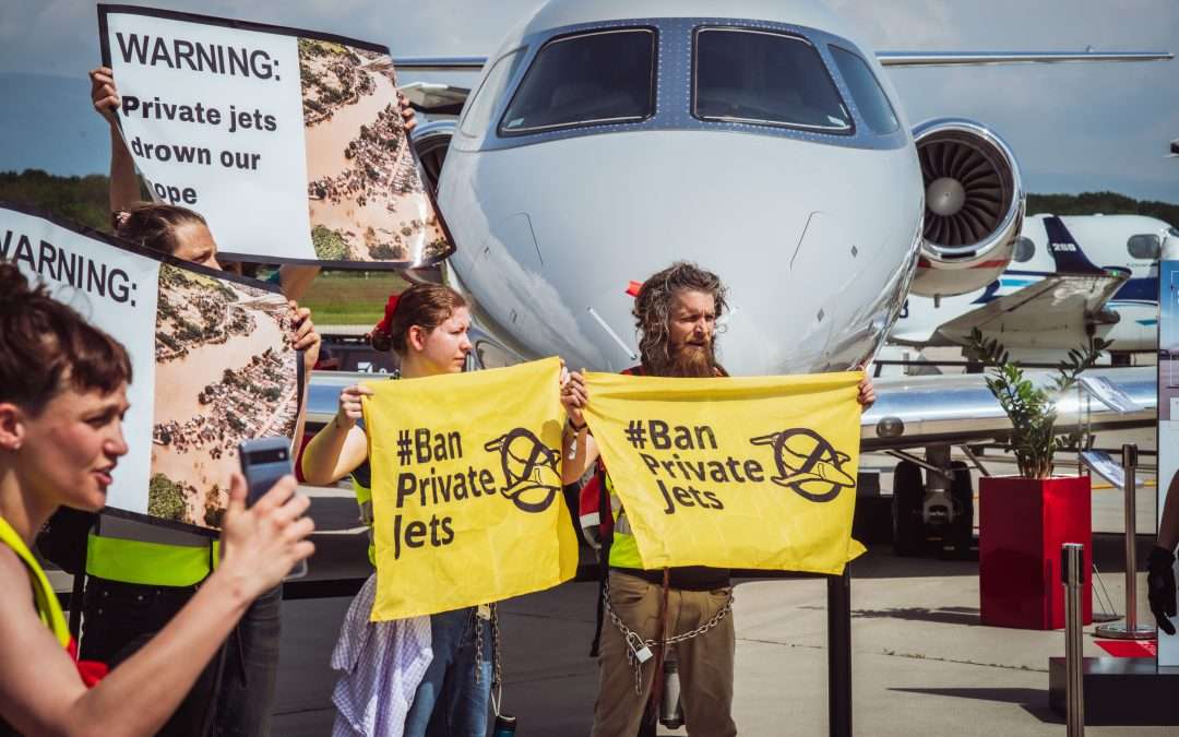 One hundred climate activists block private jets at biggest sales event in Europe, protesting luxury mega-polluters