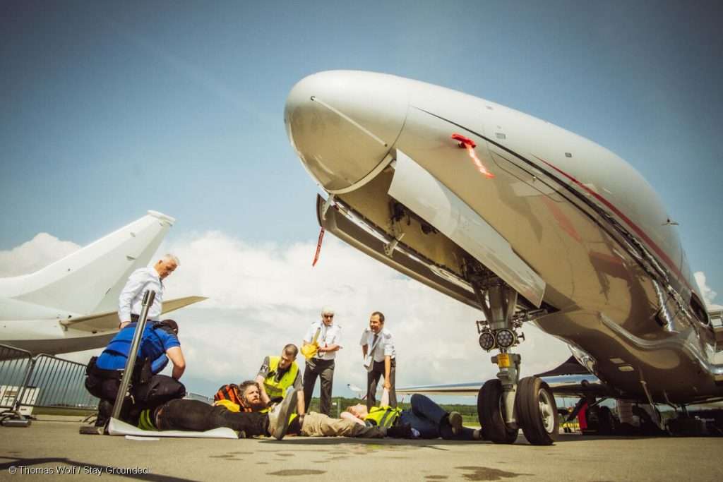 Activists occupying EBACE, Europe's biggest private jet fair in Geneva